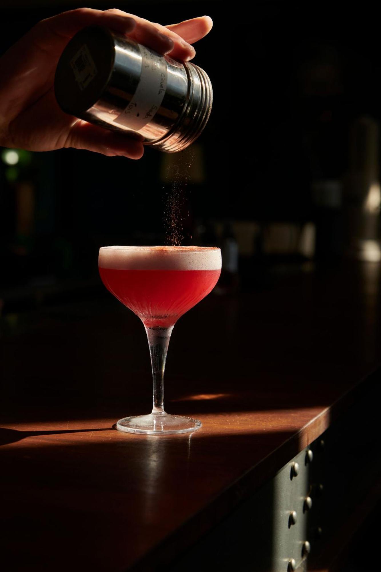 The Click Clack Hotel Medellín Zewnętrze zdjęcie A Clover Club cocktail being garnished with ground nutmeg